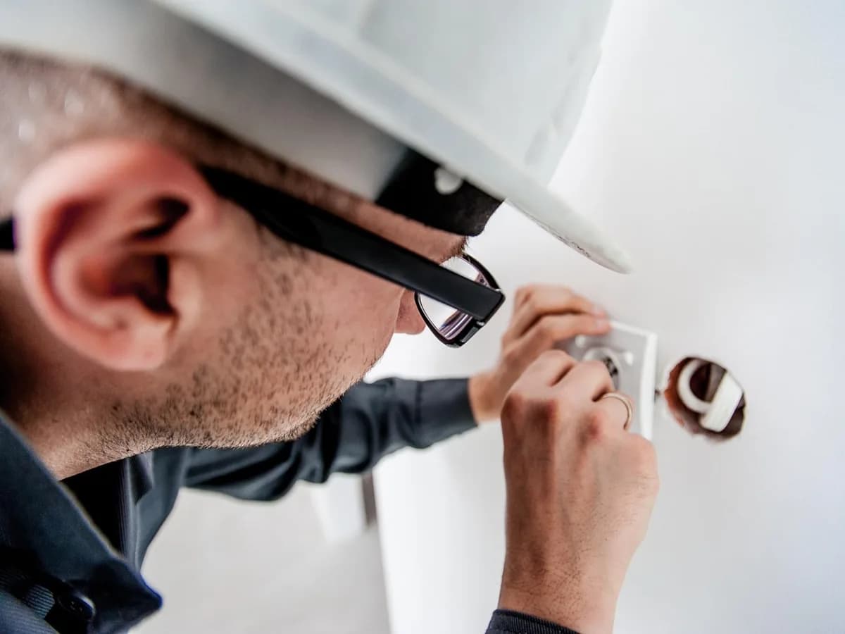 Electrician fitting a socket in a home